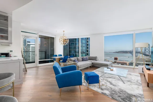 a dining room with furniture a chandelier and window