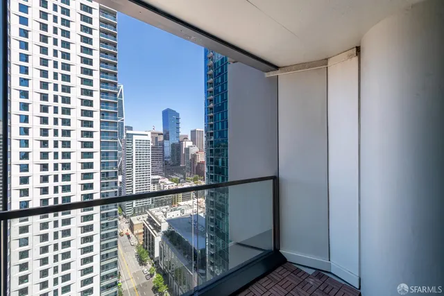 a view of balcony with wooden floor