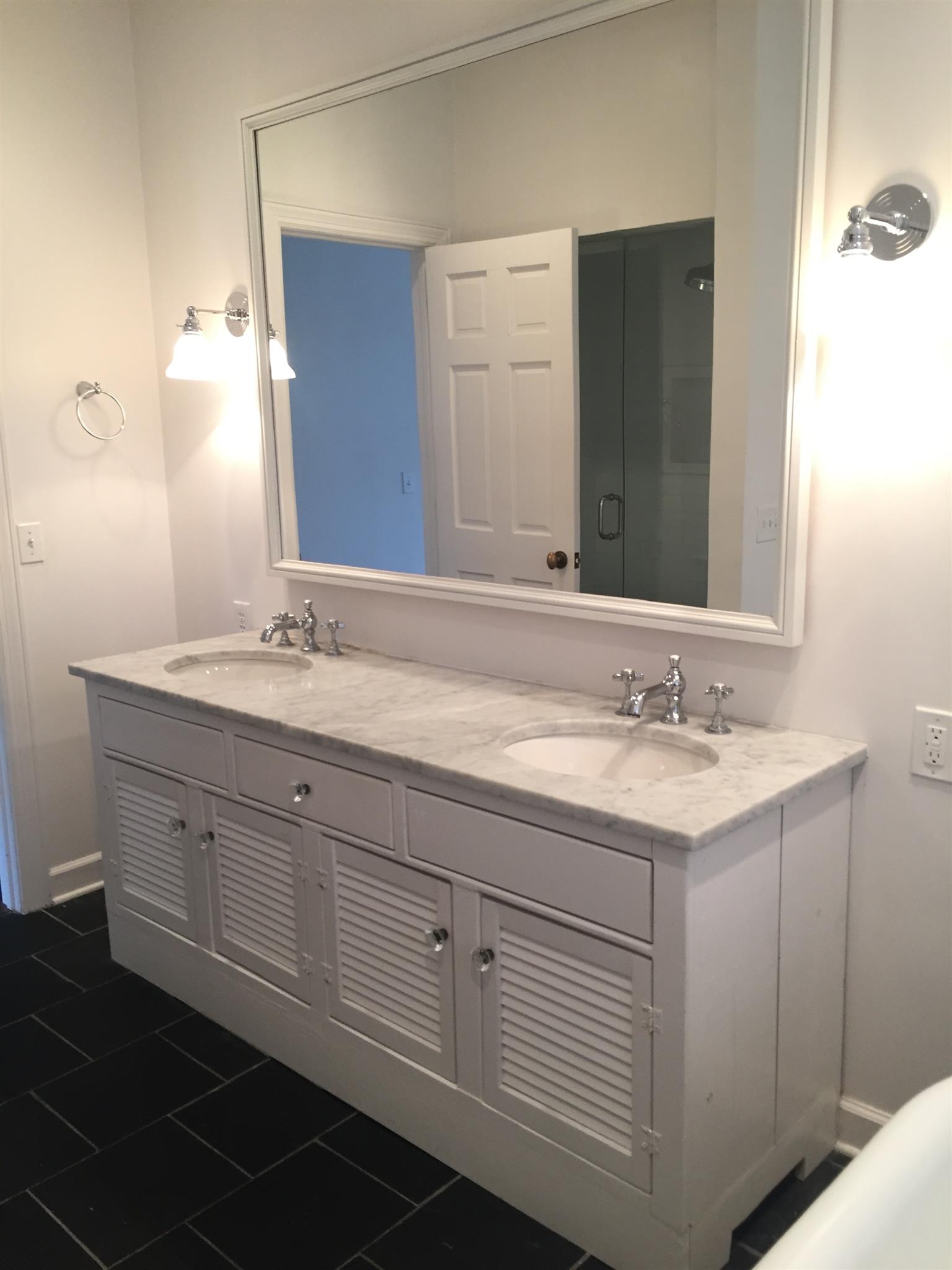 9366 Hester Beasley Road Nashville, TN 37221 - Photo 11 of 29 This Elegant Master Bath Vanity Features Marble Counters, Two Sinks, Chrome Hardware, and Stately Design for the Master Bath.