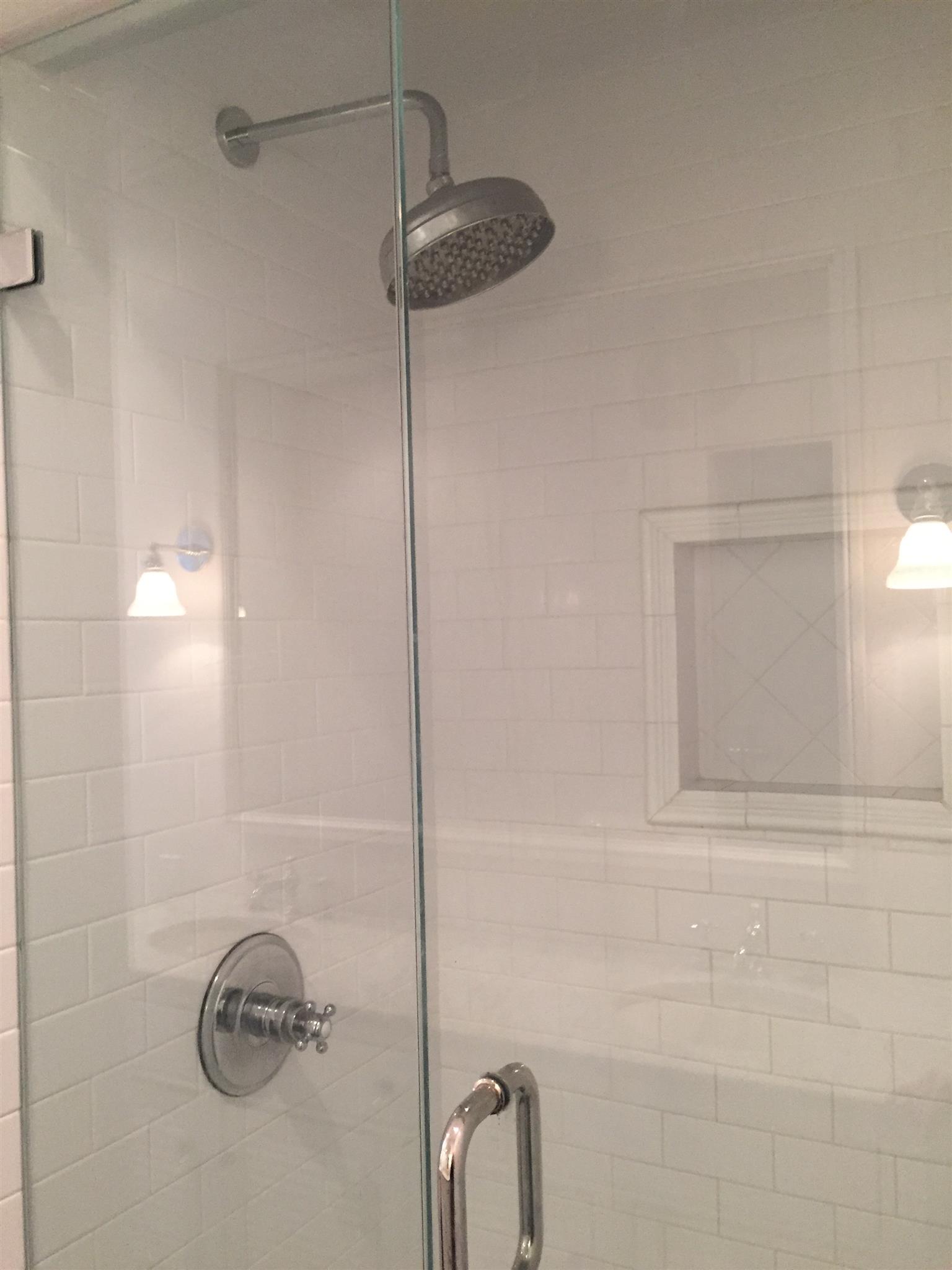 9366 Hester Beasley Road Nashville, TN 37221 - Photo 13 of 29 The Master Shower Features Custom Tile, Frameless Glass Doors, and Chrome Fixtures.