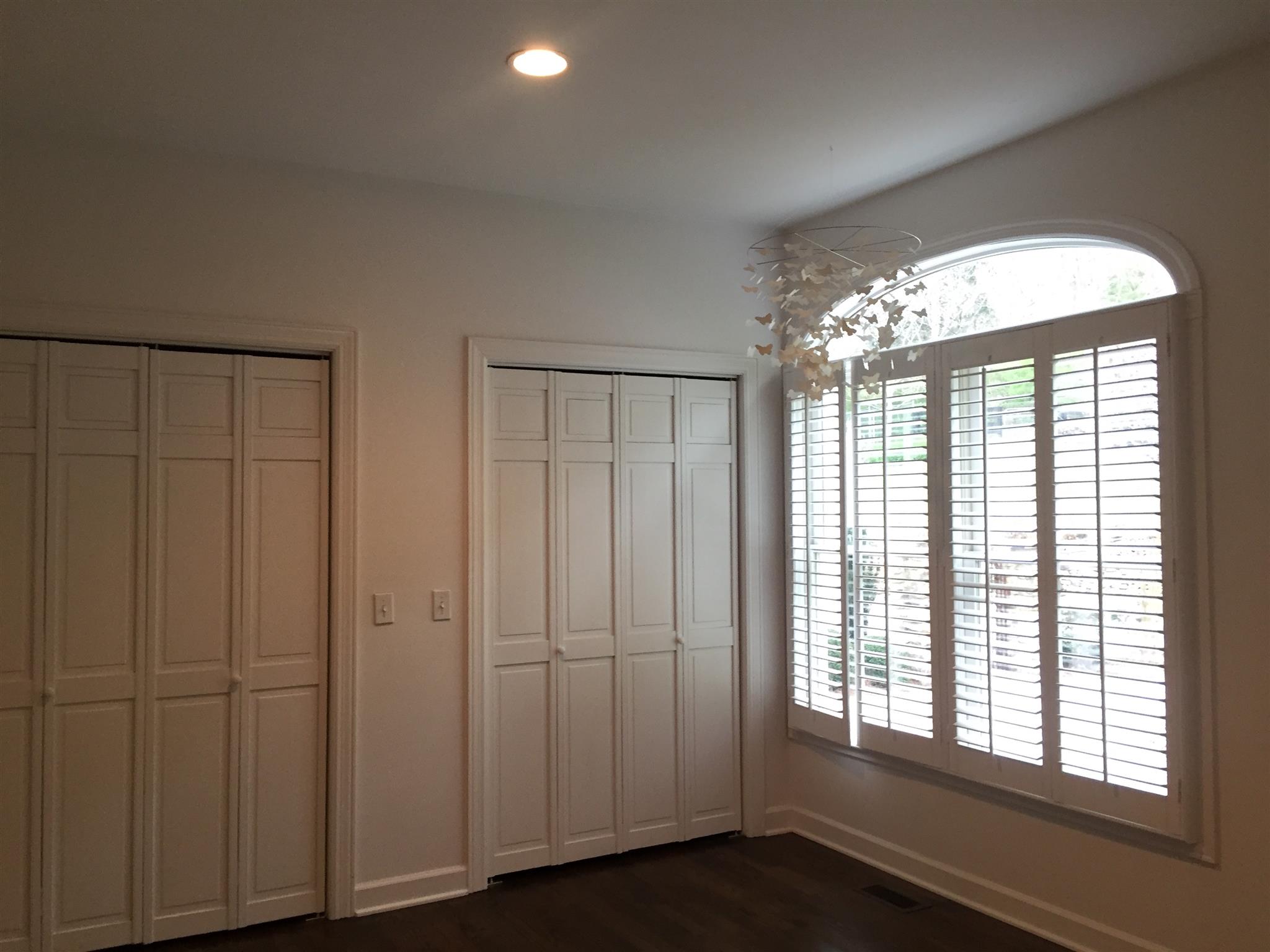9366 Hester Beasley Road Nashville, TN 37221 - Photo 15 of 29 The Second First Floor Bedroom Has Plantation Shutters, Double Closets, Recessed Lights, and Hardwood Floors.