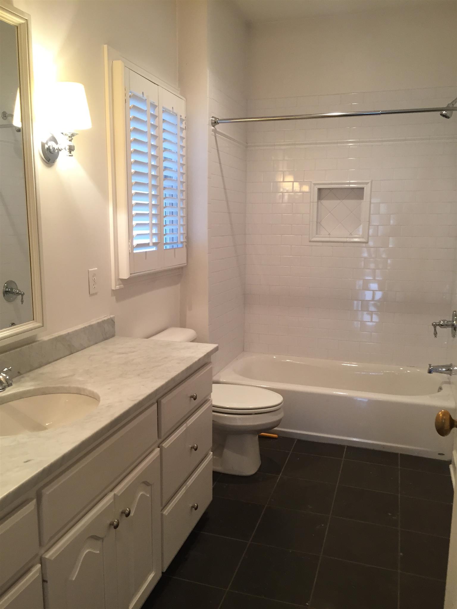 9366 Hester Beasley Road Nashville, TN 37221 - Photo 16 of 29 This Full Bath has a Spacious Vanity with Marble Countertop, Custom Tiled Combo/Shower & Tub, and Plantation Shutters.