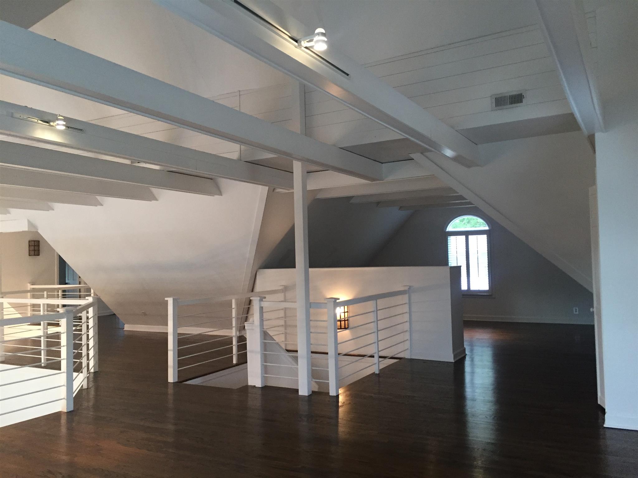 9366 Hester Beasley Road Nashville, TN 37221 - Photo 18 of 29 Here's a View of the Second Level with the Office Toward the Back, the Stairwell in the Center, and the Walkway Leading to Bedroom Three