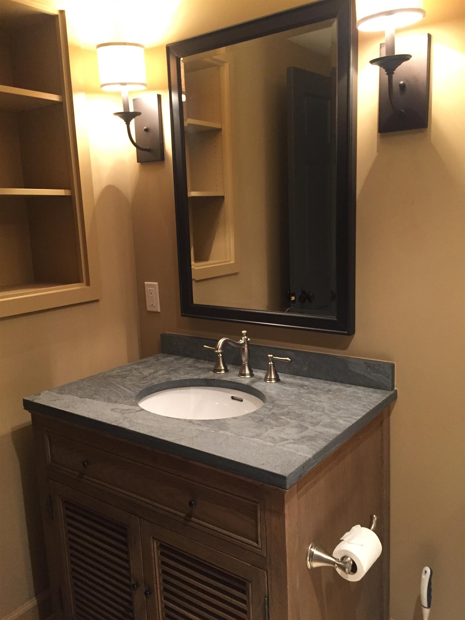 9366 Hester Beasley Road Nashville, TN 37221 - Photo 24 of 29 The Basement has a Full Bath with this Handsome Vanity and Stylish Wall Sconces.
