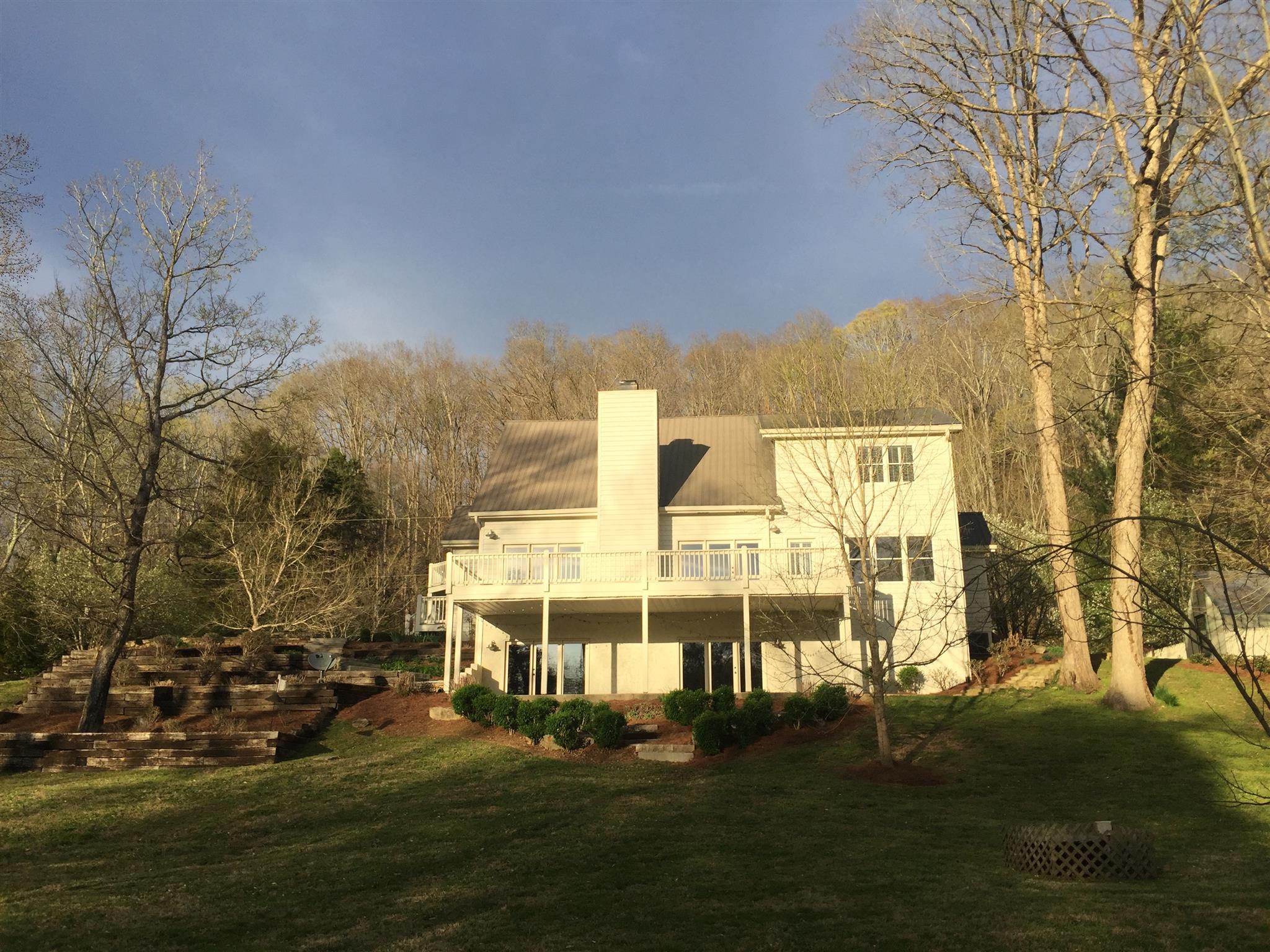 9366 Hester Beasley Road Nashville, TN 37221 - Photo 26 of 29 Views of the House from the River Show the Covered Porch from the Walkout Basemnent, and the Second Floor Balcony!