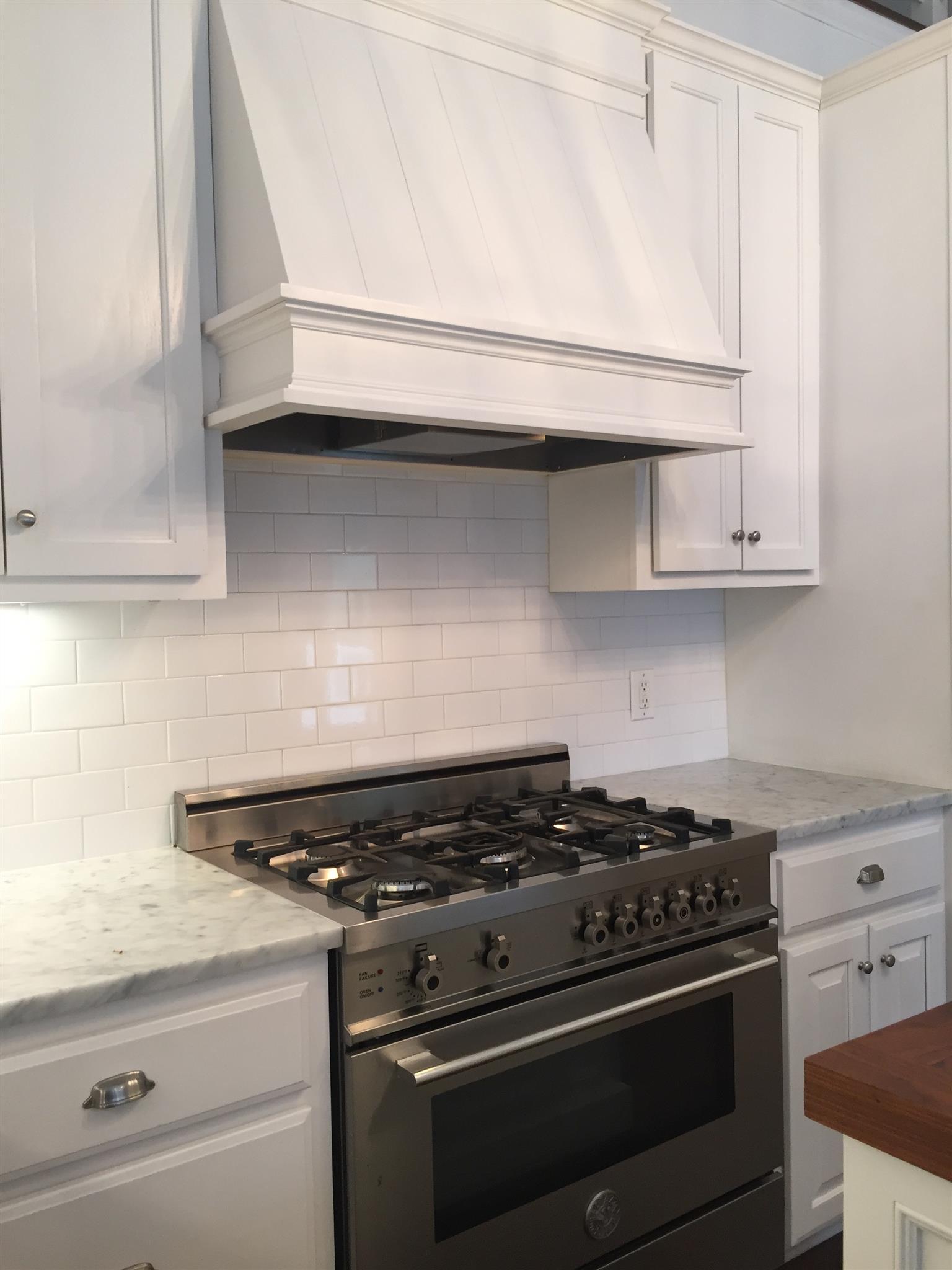 9366 Hester Beasley Road Nashville, TN 37221 - Photo 6 of 29 A Tasteful Custom Cabinet Vent Hood and a Gas Stove Make Are Perfect for the Master Chef!