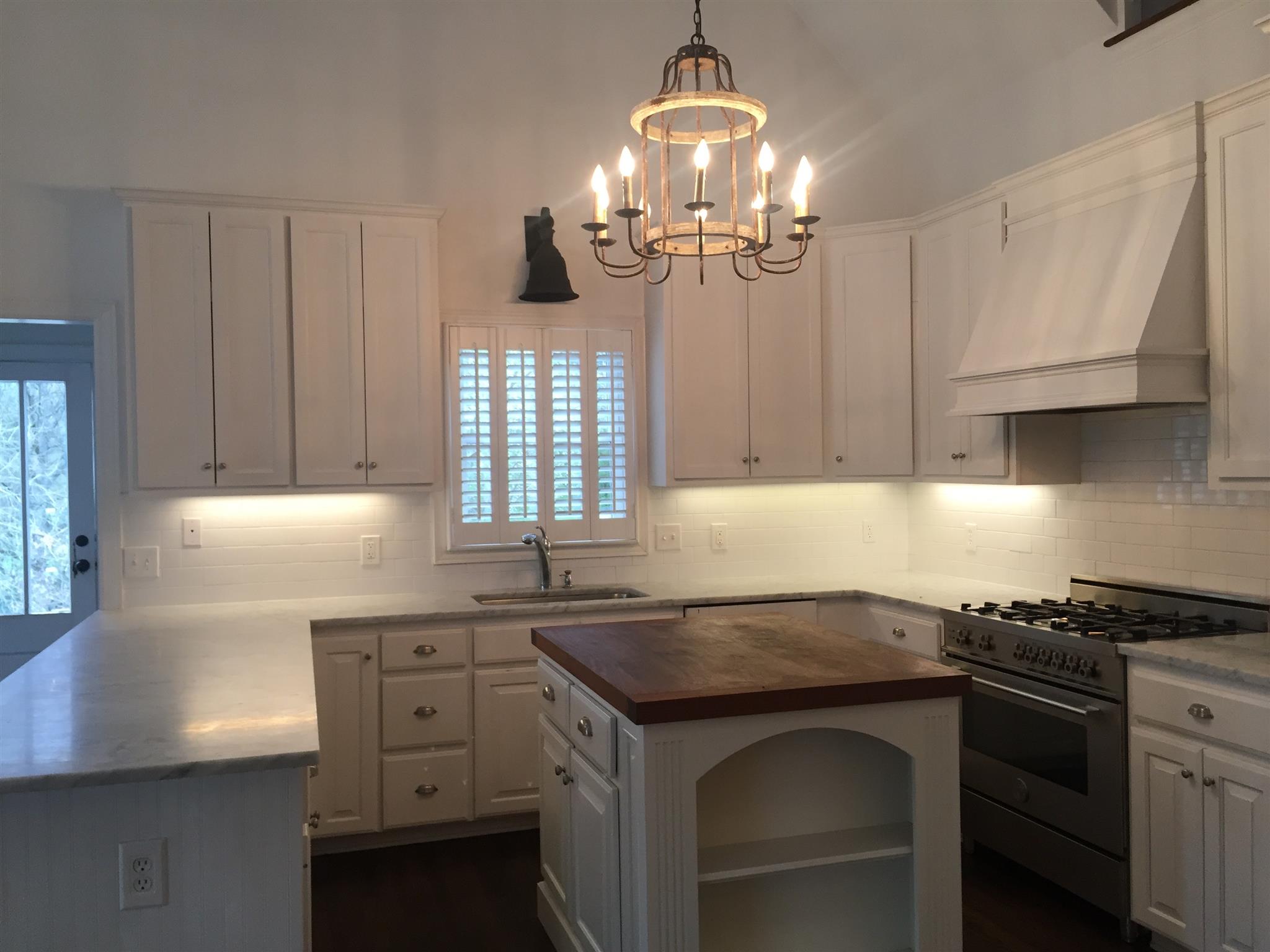 9366 Hester Beasley Road Nashville, TN 37221 - Photo 7 of 29 This Fabulous Kitchen Features White Custom Cabinets, Marble Counters, and a Custom Island with Solid Wood Top!