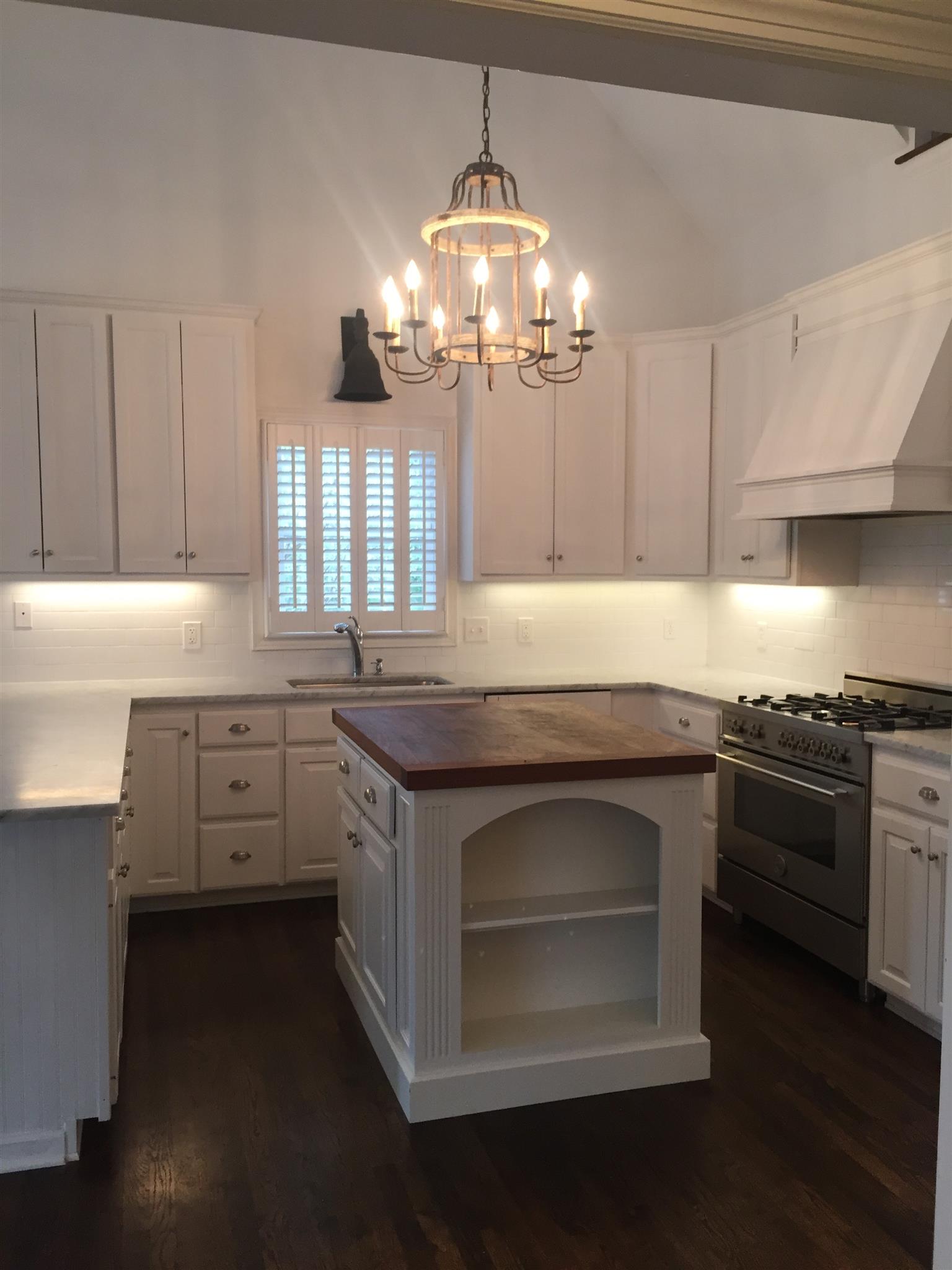 9366 Hester Beasley Road Nashville, TN 37221 - Photo 8 of 29 The Designer Chandelier, Under Cabinet Lighting, and Lots of Windows Provide Abundant Natural Light in this Beautiful Space!