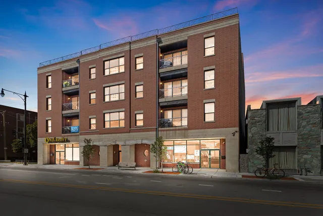 a front view of a building with a street