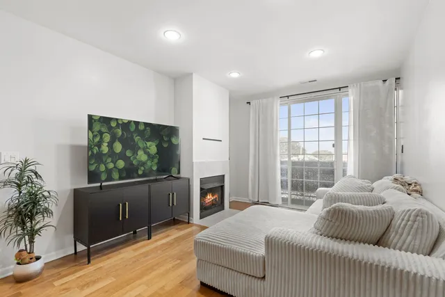 a bedroom with furniture and a flat screen tv