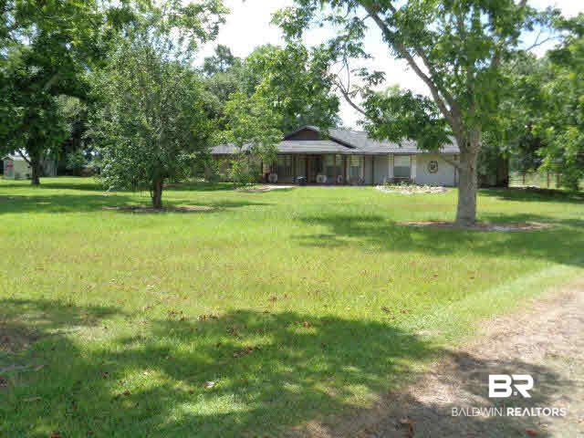 28202 Vargo Lane Elberta, AL 36530 - Photo 3 of 45 One owner home!! Built in 1995.Home has 2 identical master suites on either end of the home. At the center of the home is the living and dining rooms, kitchen, great room and half bath.