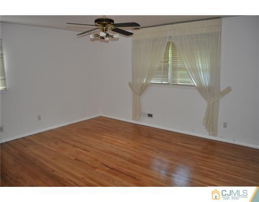 1 Agate Road East Brunswick, NJ 08816 - Photo 14 of 25 a view of empty room with wooden floor