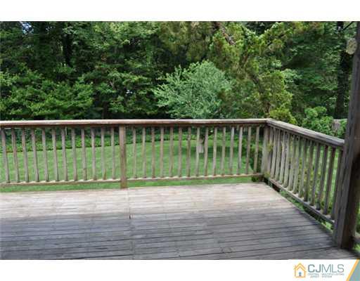 1 Agate Road East Brunswick, NJ 08816 - Photo 18 of 25 a view of balcony with wooden floor