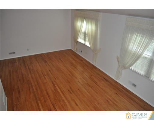 1 Agate Road East Brunswick, NJ 08816 - Photo 3 of 25 a view of an empty room and window