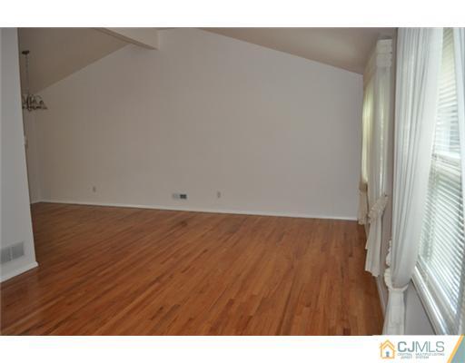 1 Agate Road East Brunswick, NJ 08816 - Photo 4 of 25 a view of an empty room and window