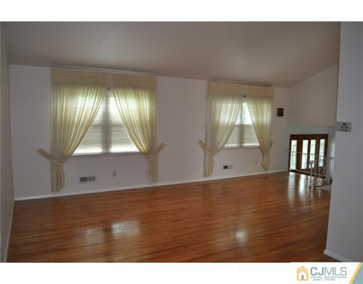 1 Agate Road East Brunswick, NJ 08816 - Photo 7 of 25 a view of empty room with window