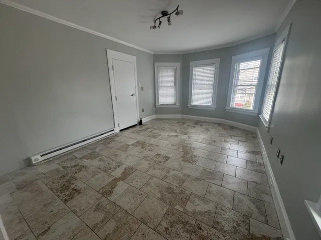 a view of an empty room with a window