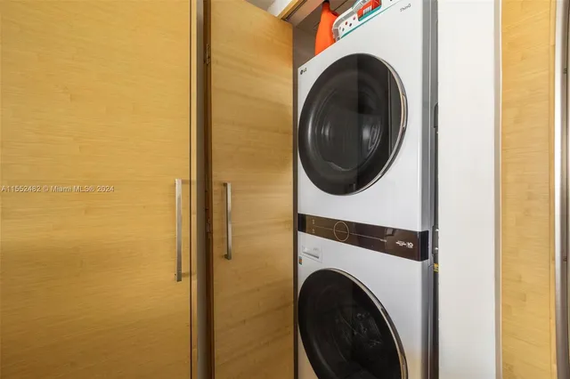 a view of a hallway with washer and dryer