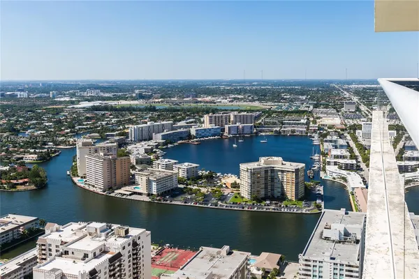 an aerial view of a house with a ocean view