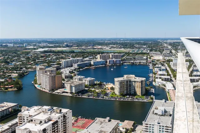 an aerial view of a house with a ocean view