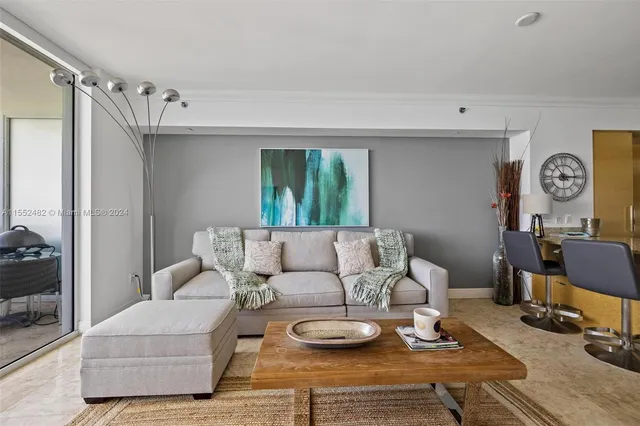 a living room with furniture and a table