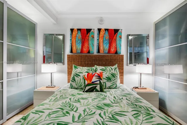 a bedroom with a bed and a painting on the wall