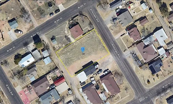 an aerial view of a house with a mountain