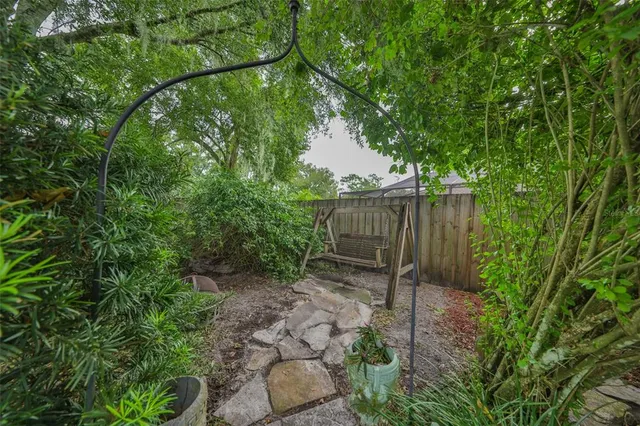a backyard of a house with lots of green space