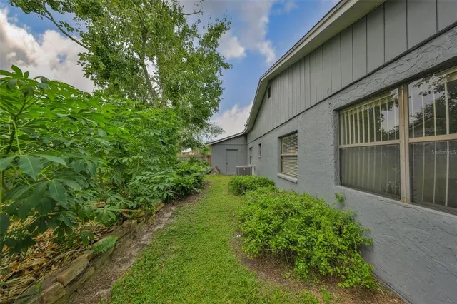 a backyard of a house with lots of green space