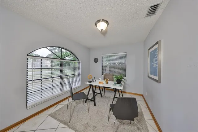 a workspace with furniture window and outside view