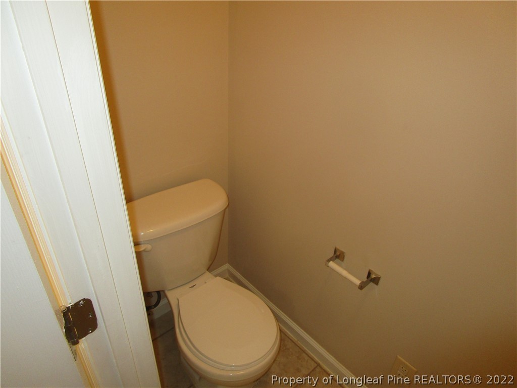 4328 Rocinta Court Hope Mills, NC 28348 - Photo 17 of 39 a white toilet sitting next to a shower