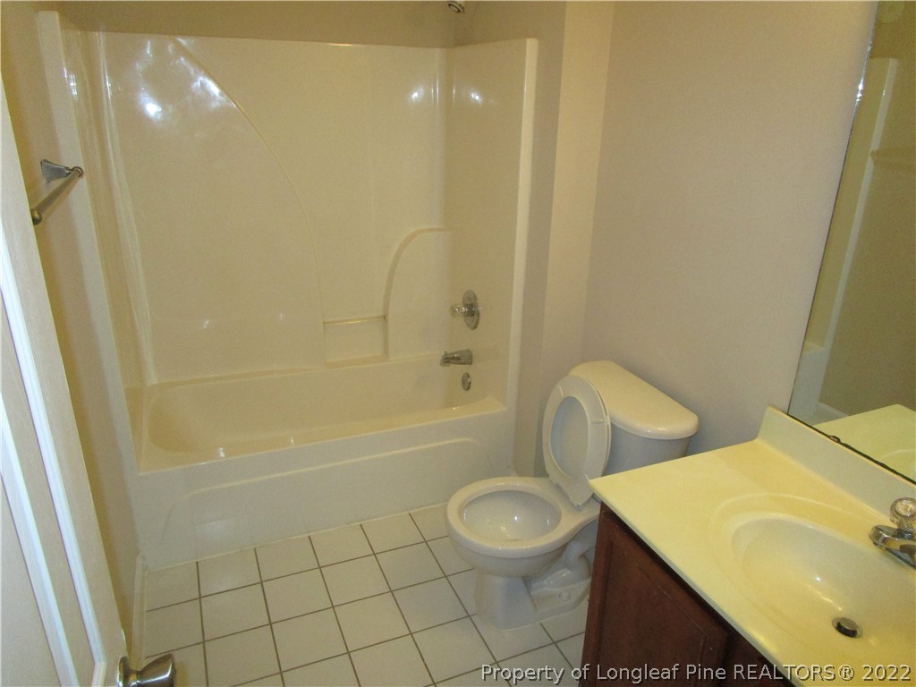 4328 Rocinta Court Hope Mills, NC 28348 - Photo 21 of 39 a bathroom with a sink a toilet and shower
