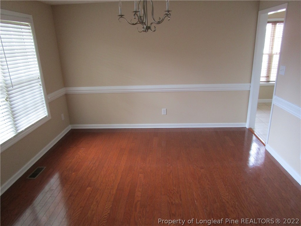 4328 Rocinta Court Hope Mills, NC 28348 - Photo 7 of 39 a view of room with window and hardwood floor