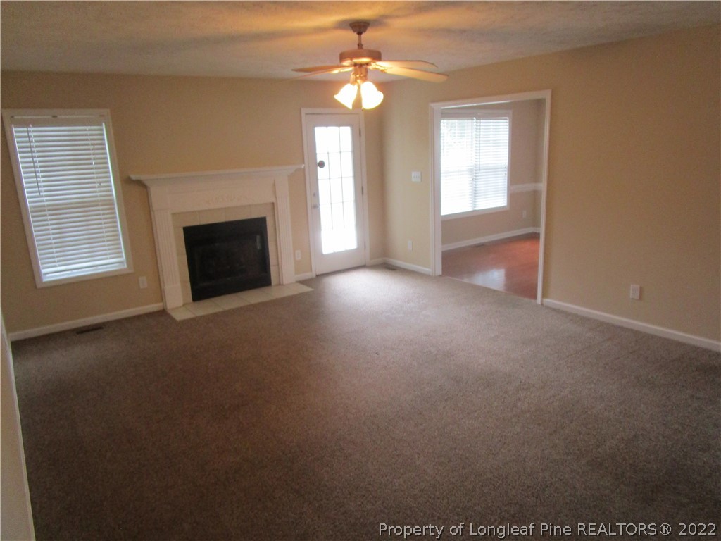 4328 Rocinta Court Hope Mills, NC 28348 - Photo 9 of 39 a view of empty room with a fireplace