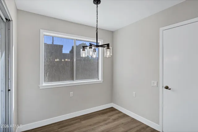 a kitchen with kitchen island a counter top space a sink stainless steel appliances and cabinets