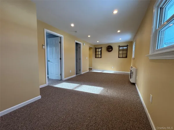 a view of a big room with windows