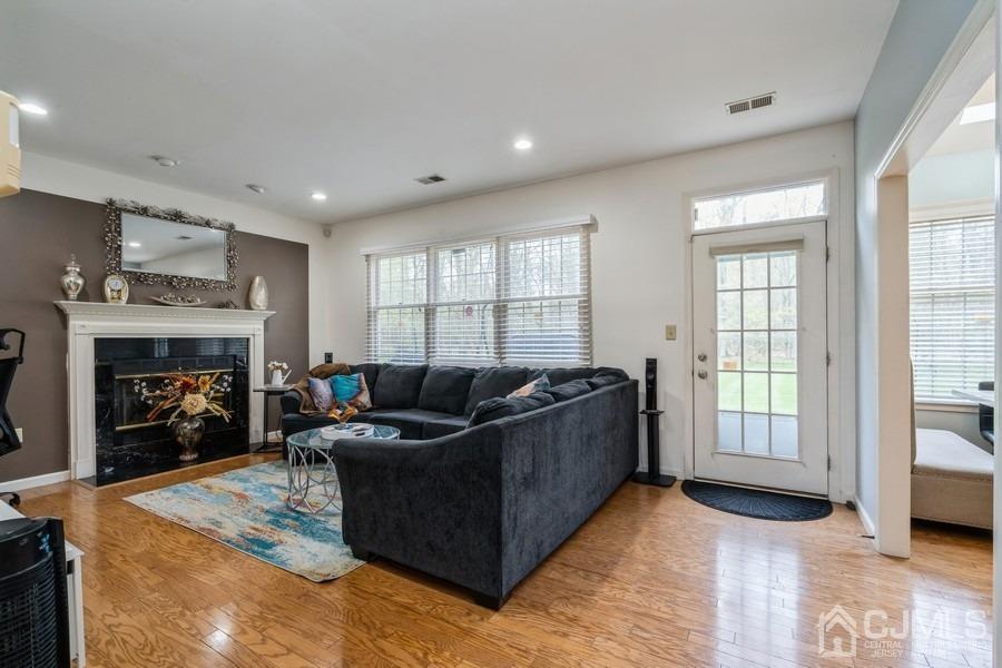 11 Tree Farm Road Monmouth Junction, NJ 08852 - Photo 13 of 27 a living room with furniture and a fireplace