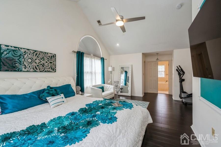11 Tree Farm Road Monmouth Junction, NJ 08852 - Photo 17 of 27 a spacious bedroom with a large bed a chandelier and windows