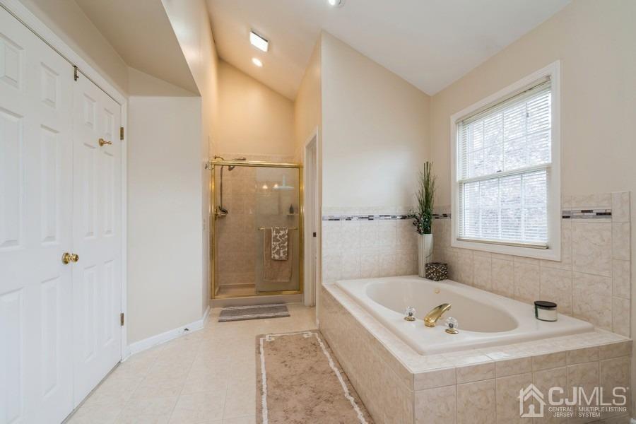 11 Tree Farm Road Monmouth Junction, NJ 08852 - Photo 18 of 27 a bathroom with a tub a sink and a shower