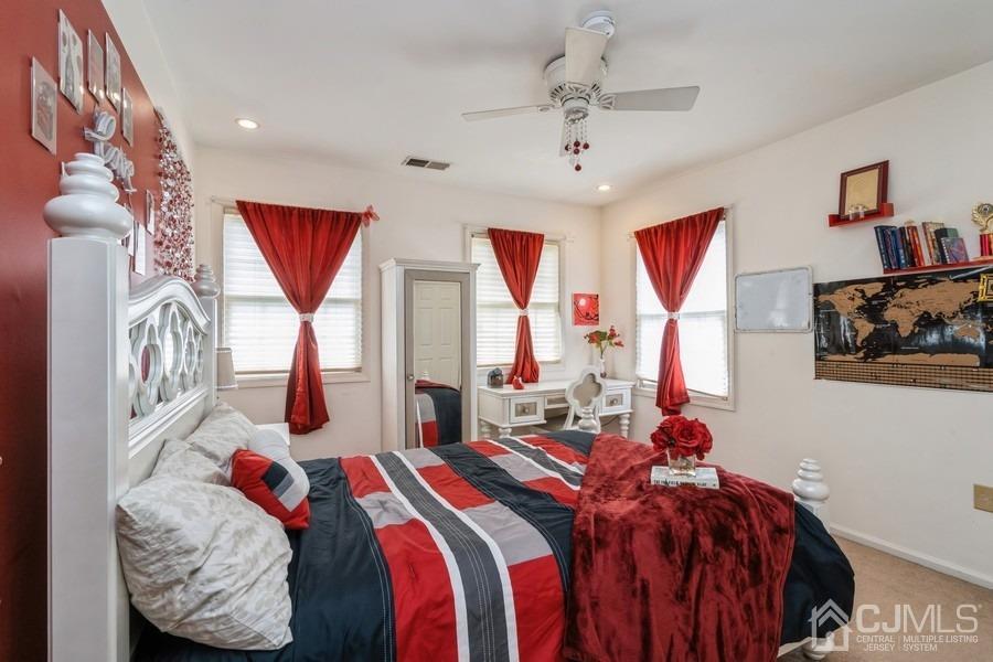 11 Tree Farm Road Monmouth Junction, NJ 08852 - Photo 22 of 27 a bedroom with bed and a chandelier