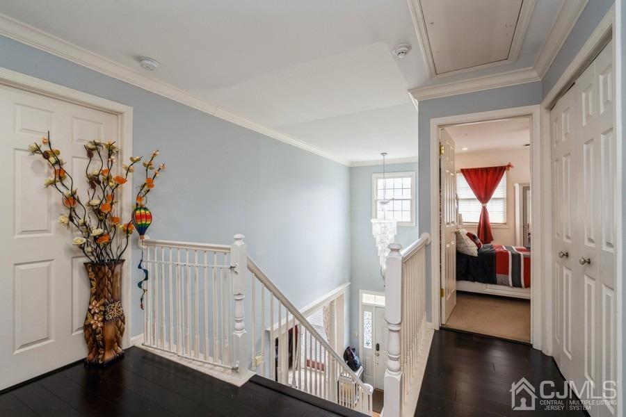 11 Tree Farm Road Monmouth Junction, NJ 08852 - Photo 23 of 27 a view of a hallway with wooden floor and stairs