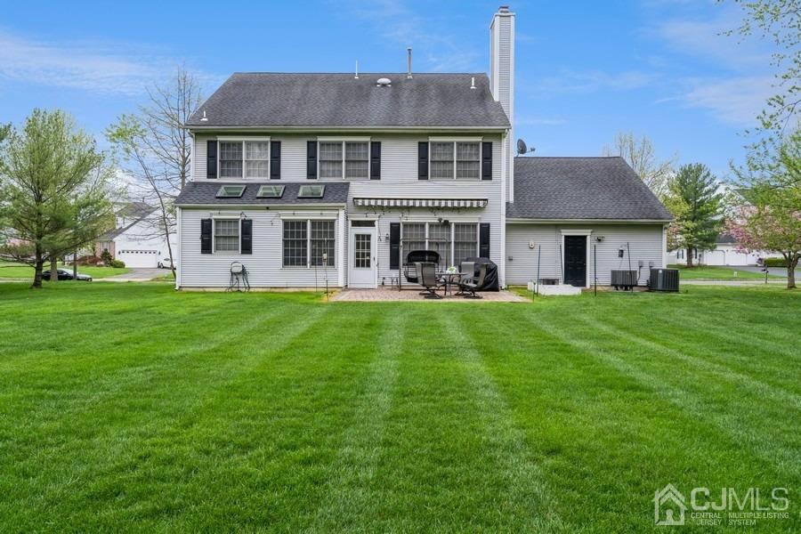 11 Tree Farm Road Monmouth Junction, NJ 08852 - Photo 4 of 27 a front view of a house with garden and a tree
