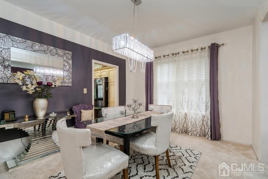 11 Tree Farm Road Monmouth Junction, NJ 08852 - Photo 8 of 27 a view of a dining room with furniture and chandelier