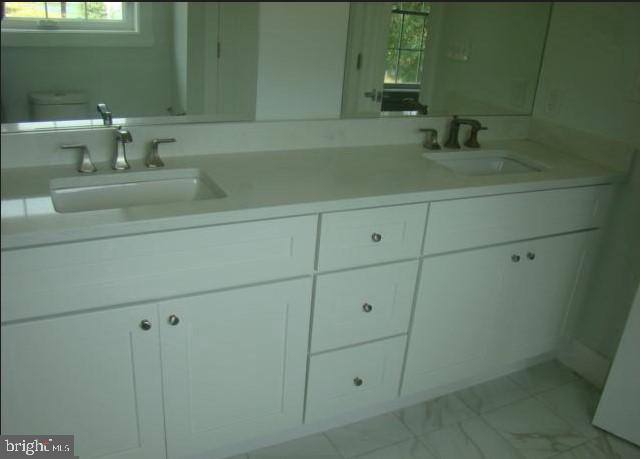 1520 Webster Place Edgewater, MD 21037 - Photo 15 of 20 a bathroom with a sink and a mirror