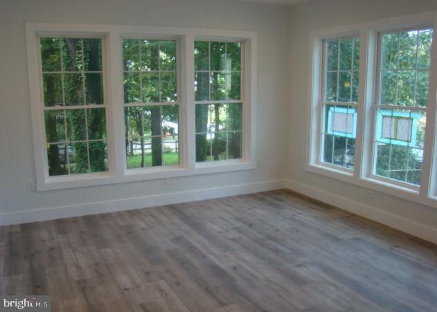 1520 Webster Place Edgewater, MD 21037 - Photo 4 of 20 a view of an empty room with wooden floor and windows