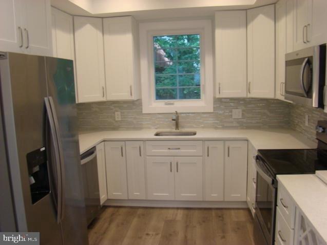 1520 Webster Place Edgewater, MD 21037 - Photo 5 of 20 a kitchen with a refrigerator sink and microwave