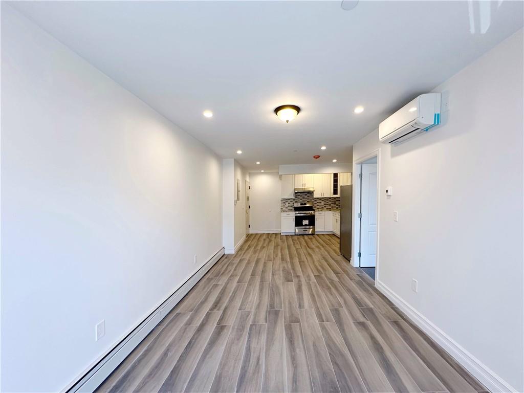 1307 84th Street, Unit 2B Brooklyn, NY 11228 - Photo 13 of 18 a view of a living room with wooden floor
