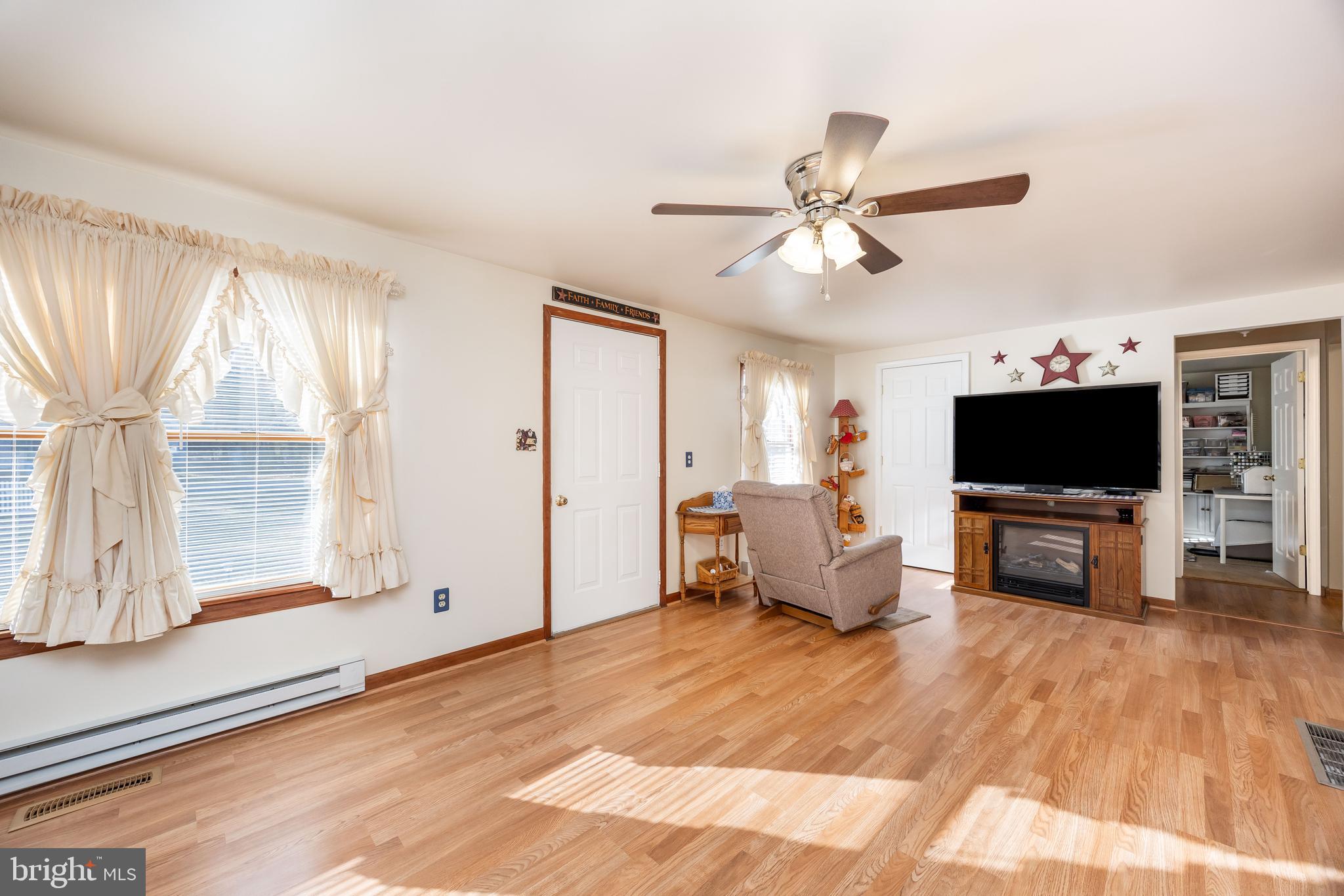 911 Outten Road Salisbury, MD 21804 - Photo 11 of 36 a living room with furniture and a flat screen tv