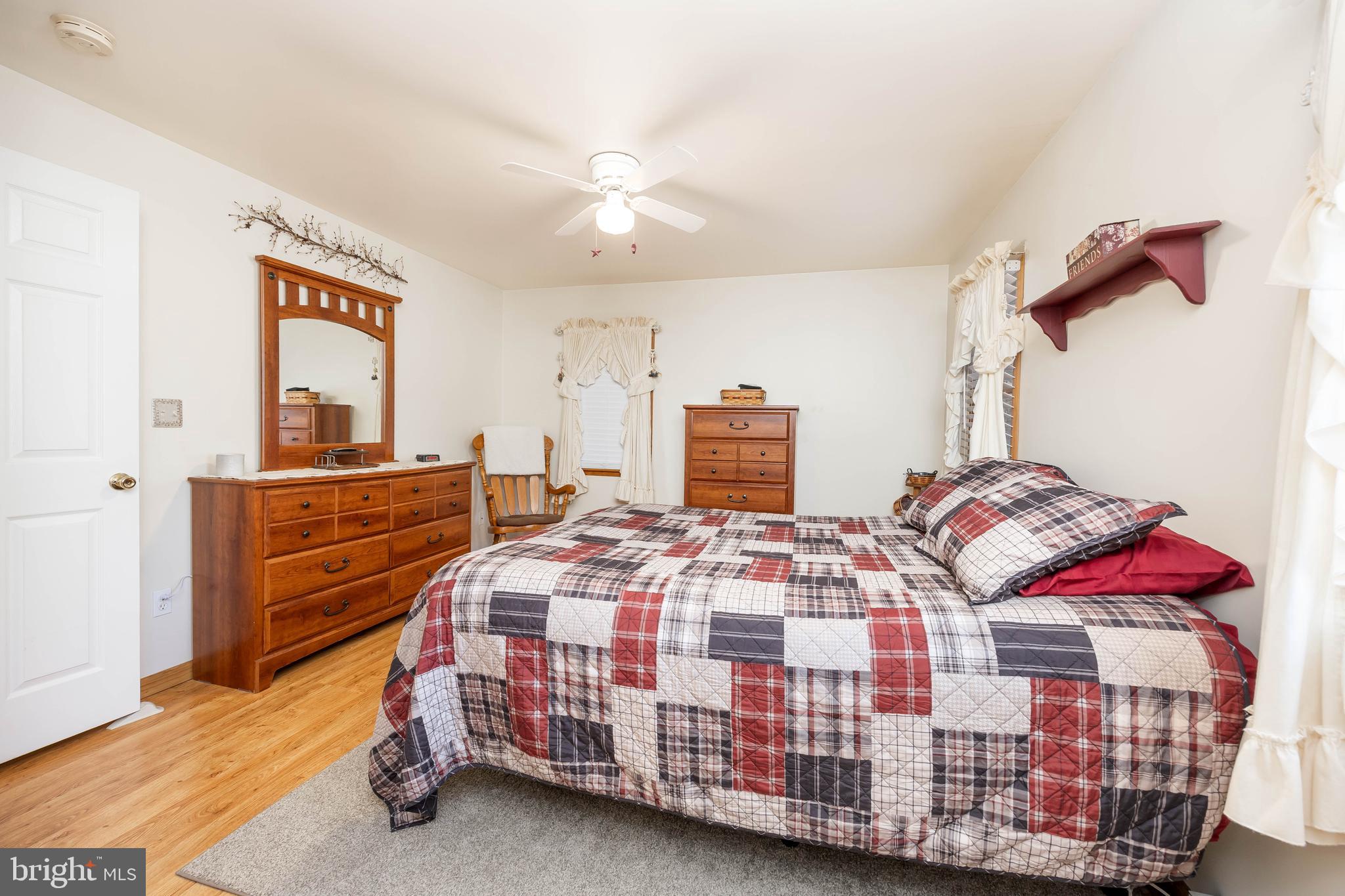911 Outten Road Salisbury, MD 21804 - Photo 16 of 36 a bedroom with a bed and dresser
