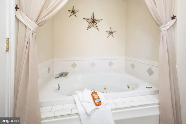 a bathroom with a bathtub and shower